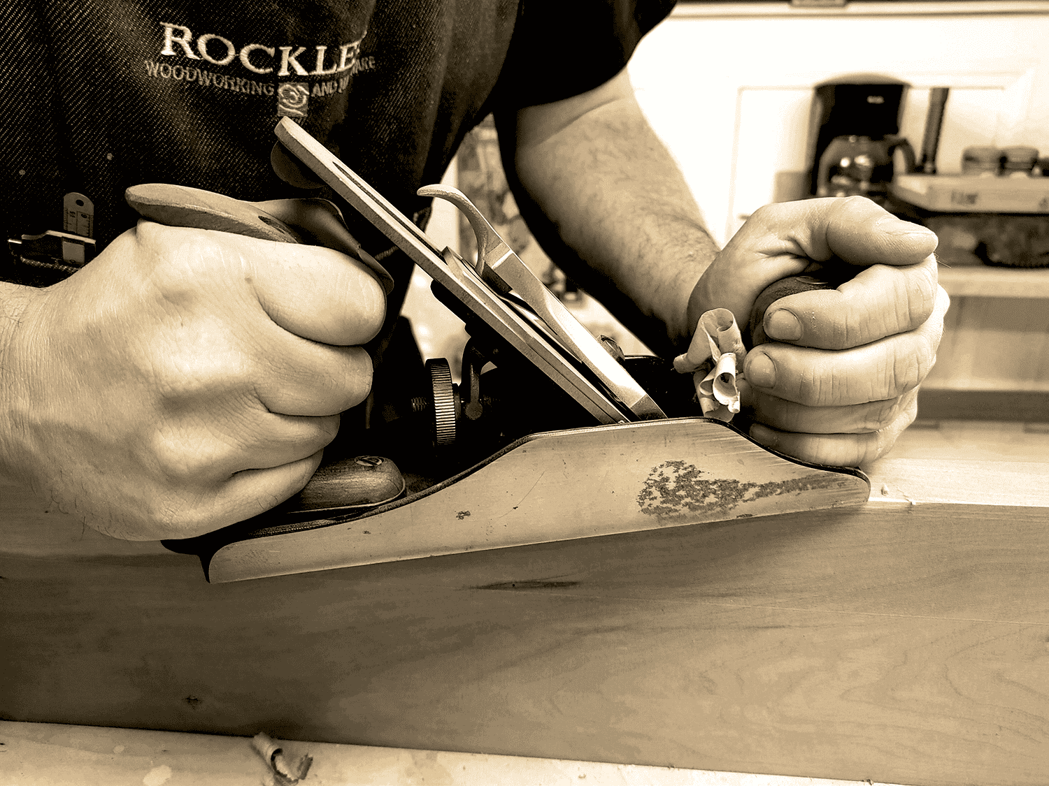 Hands using a hand plane